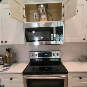Over-range microwave installed with reworked cabinet
