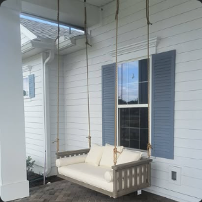 Hanging porch swing installed on a front porch