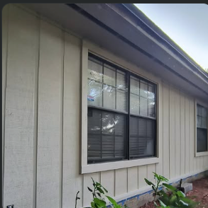 Board-and-batten siding and window trim replaced on a home exterior