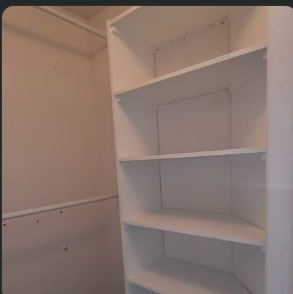 Built-in closet shelving installed and painted