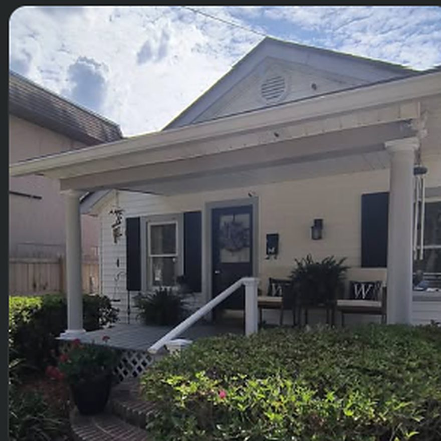 Front porch with rebuilt columns and railing