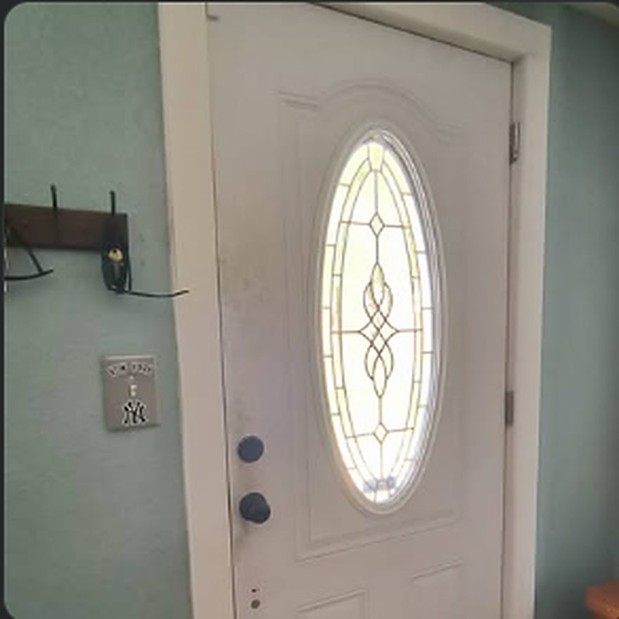 New leaded-glass entry door installed and trimmed