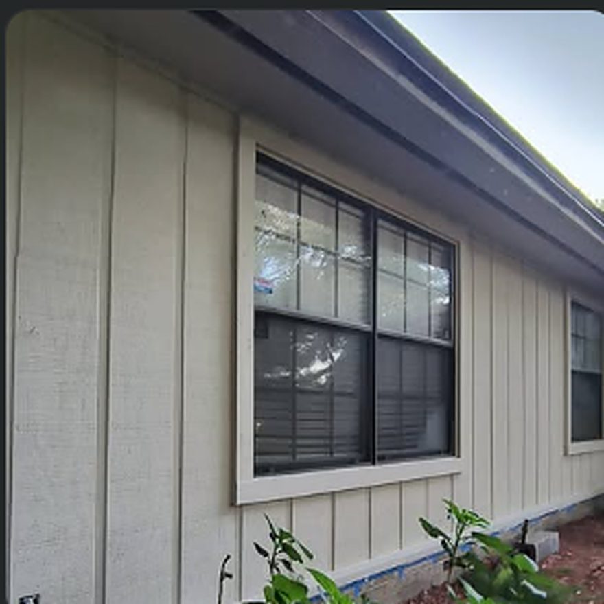 Board-and-batten siding and window trim replaced
